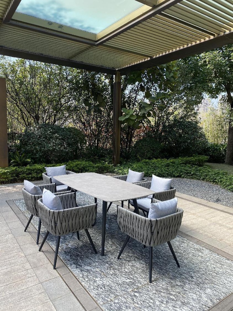 OUTDOOR GREY MARBLE AFFECT TABLE & SIX CUSHIONED CHAIRS